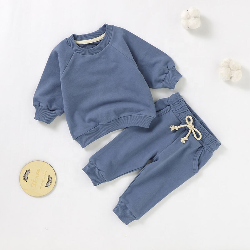 2 piece sweatsuit set for baby boys in blue.  The set includes a sweatshirt and jogger pants.  It is made from soft GOTS certified organic cotton.