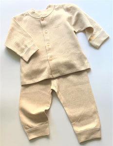2 piece gender neutral baby outfit in beige.  The set includes a button up top and matching pull on pants.  It is made from super soft GOTS certified organic cotton.