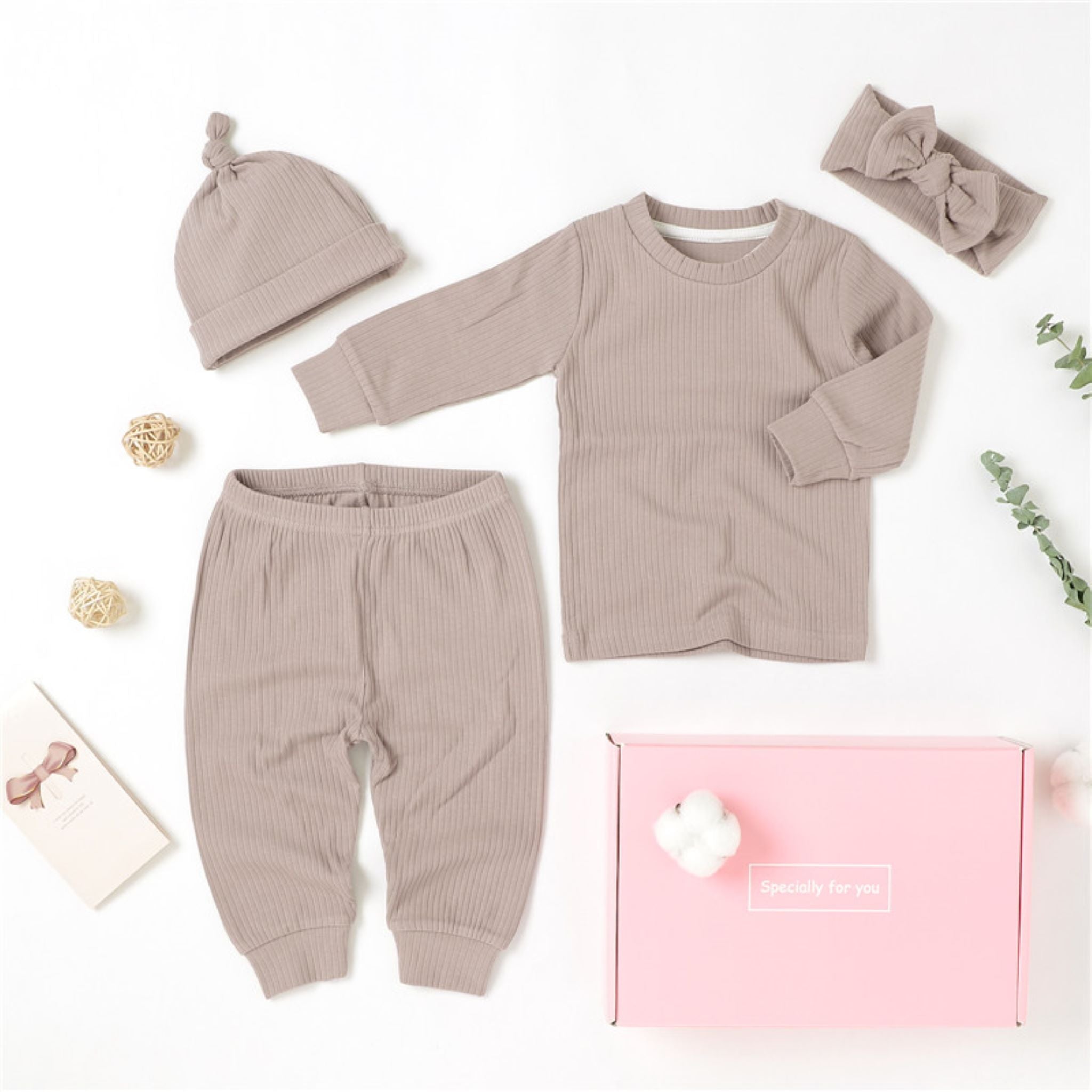 4 piece baby girl gift set in lavender.  The set includes a long sleeve top with matching pull on pants, a hat and a headband.  It is made from soft GOTS certified organic cotton.