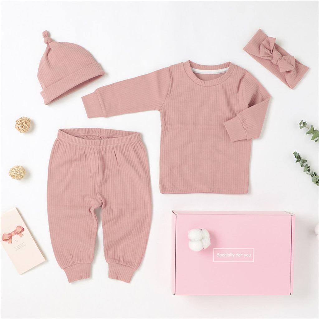 4 piece baby girl gift set in pink.  The set includes a long sleeve top with matching pull on pants, a hat and a headband.  It is made from soft, GOTS certified organic cotton.